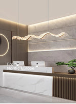 Linear gold pendant light bar counter